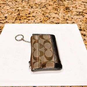 Coach mini coin wallet with key chain. Zip closure, outside pocket. Brown.